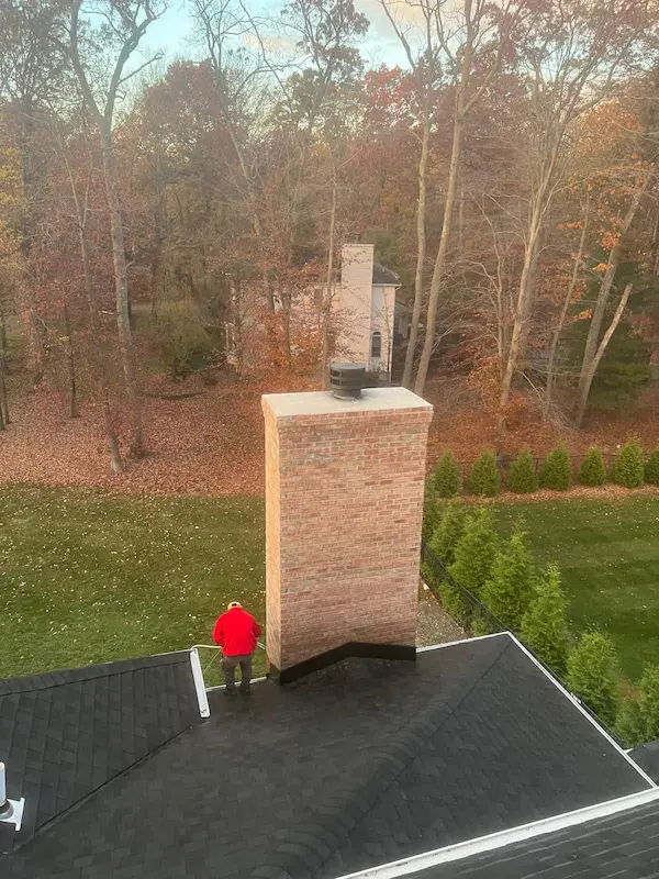 Right Deal technician repairing a brick chimney in Montgomery County PA